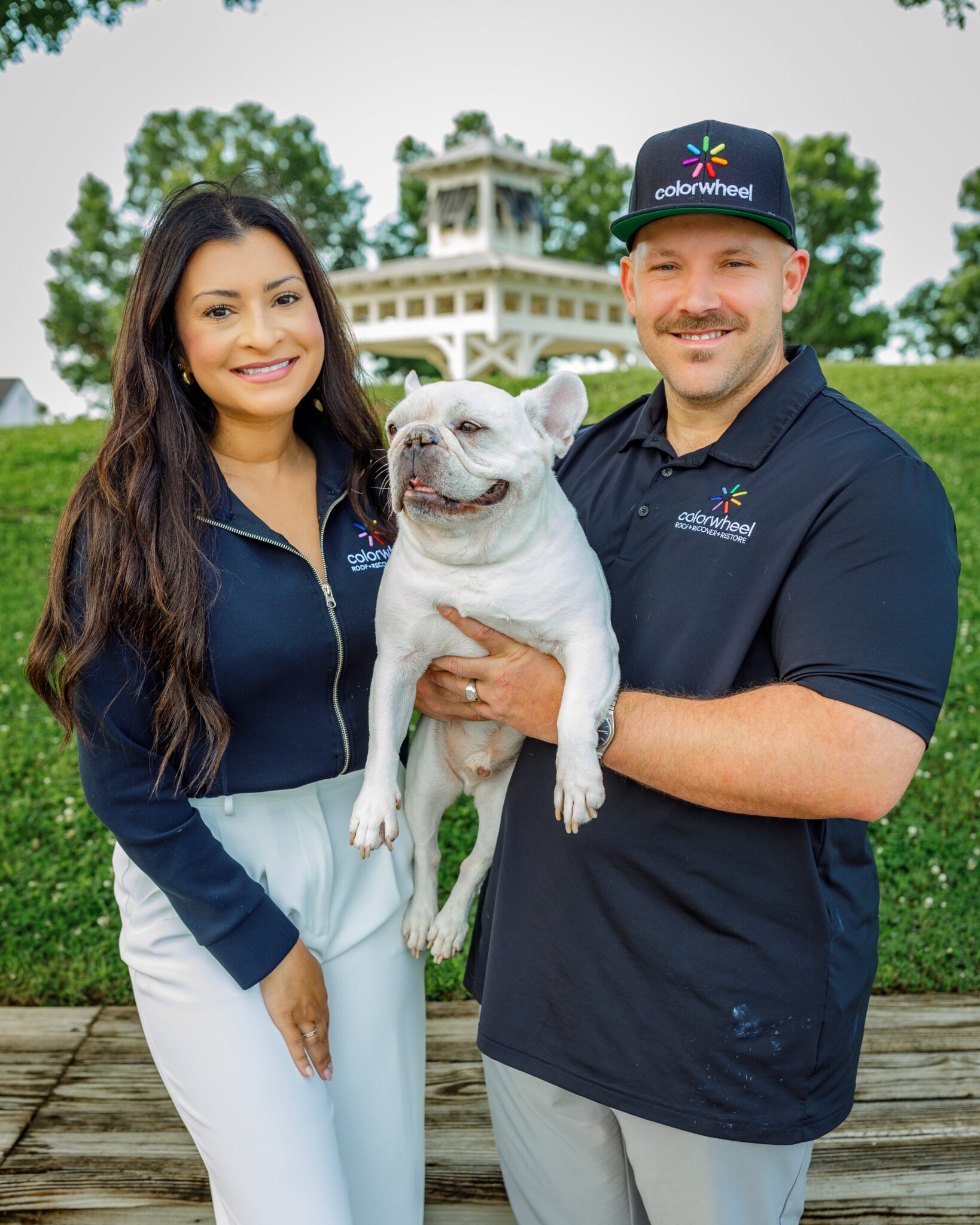 Beau and Shelly, owners of Colorwheel Roofing, with their dog Rudy