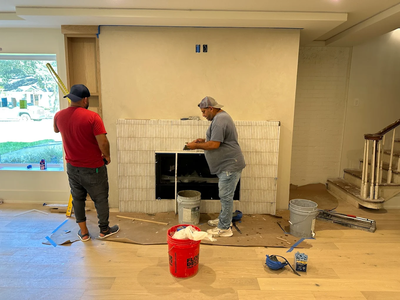 Interior remodeling with precision tile work around fireplace