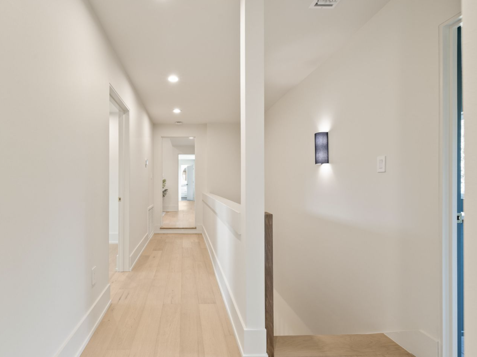 Modern renovated hallway demonstrating coordinated craftsmanship